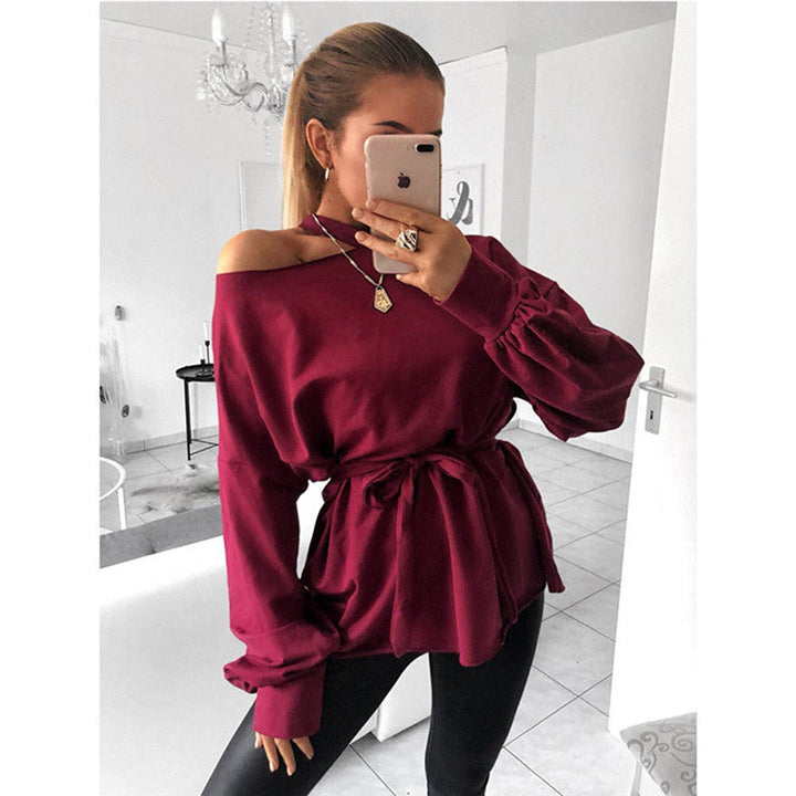 Modern long-sleeved blouse with slanted shoulder