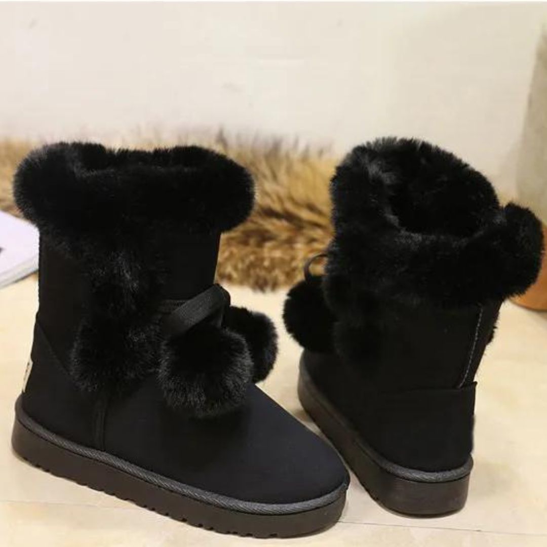 Elegant winter boots with pompom embellishment