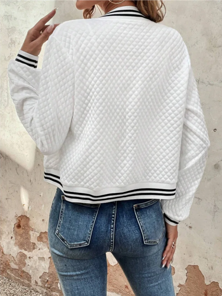 Casual bomber jacket with a light quilted pattern and striped details