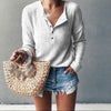 Button-up blouse with V-neck and long sleeves