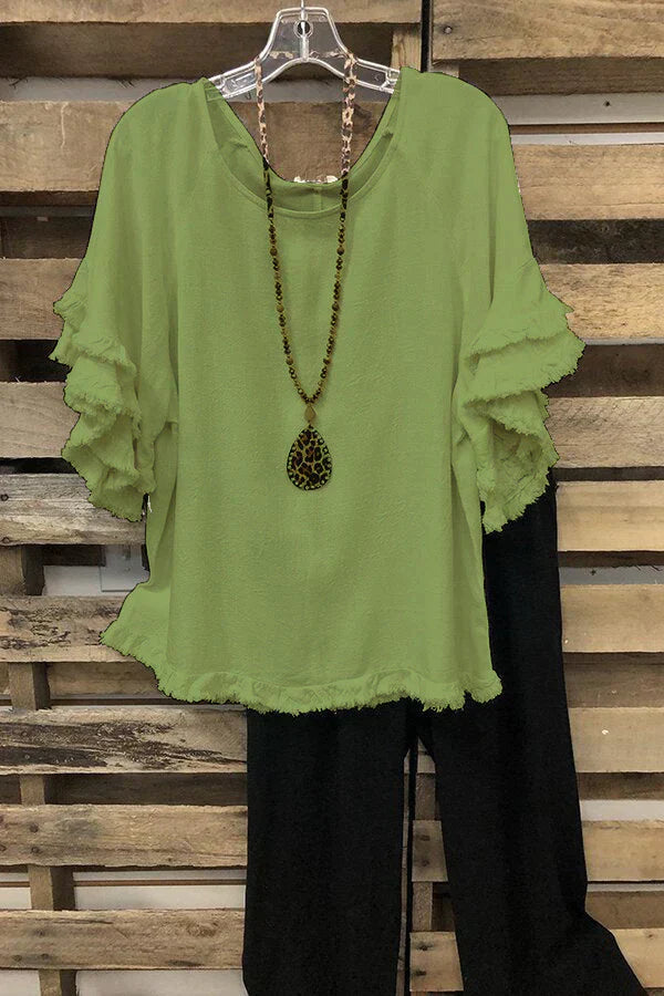 Ruffled cotton blouse with a round neckline