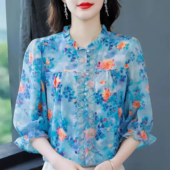 Half-high collar blouse with print and ruffles