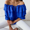 Women's blouse in loose chiffon with off-the-shoulder and flounce edge, elasticated shoulder strap