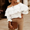 Women's blouse in loose chiffon with off-the-shoulder and flounce edge, elasticated shoulder strap