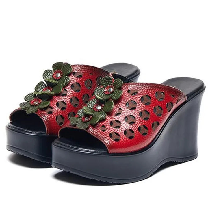 Leather sandals with floral pattern and heel