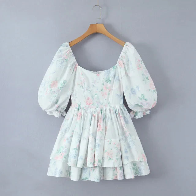 Pastel-coloured dress with floral pattern