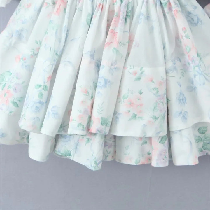 Pastel-coloured dress with floral pattern