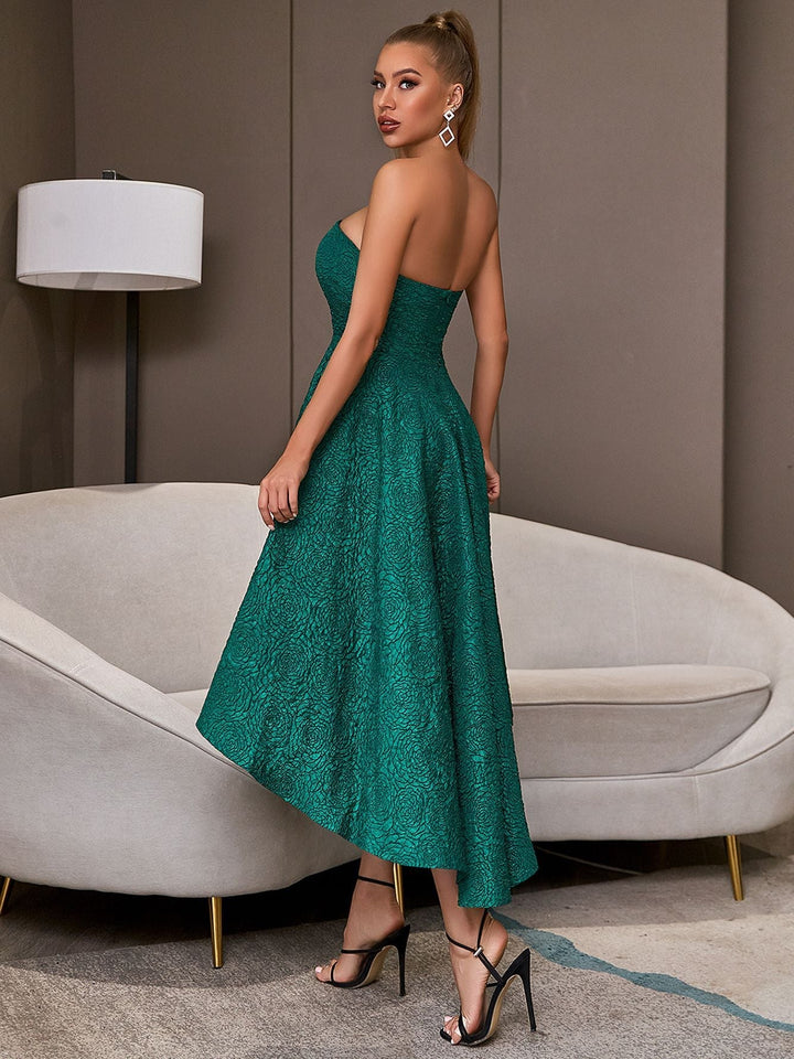 Green sleeveless elegant flared party dress with bare upper body