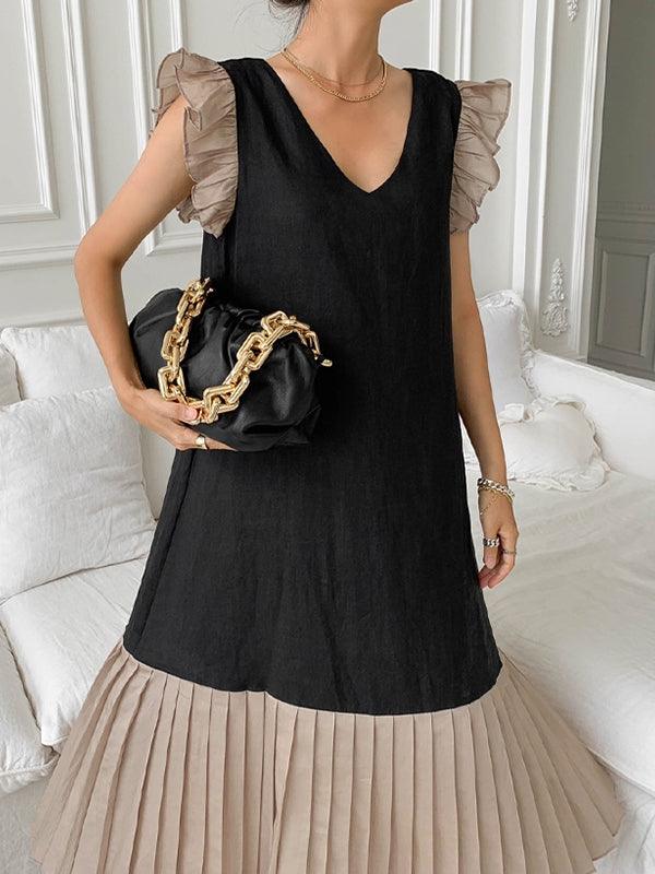 Pleated dress with V-neck and contrasting inserts