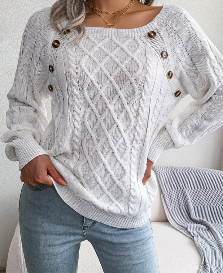 Knitted elegant women's jumper with buttons and ribbed motif