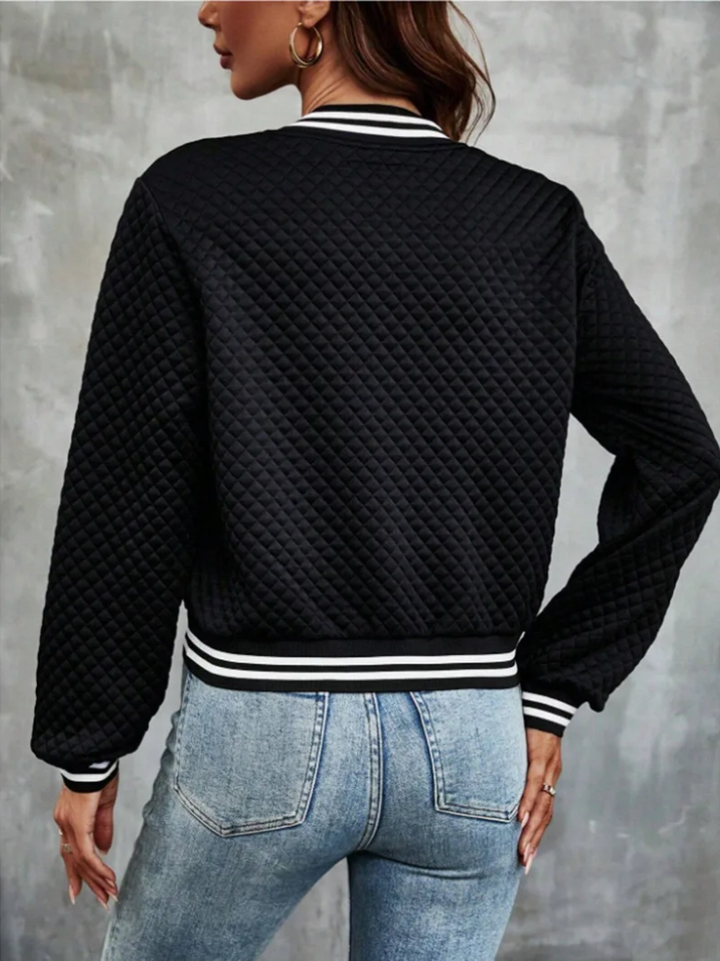 Casual bomber jacket with a light quilted pattern and striped details