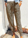 Casual jogging trousers with leopard print and fixed bottom