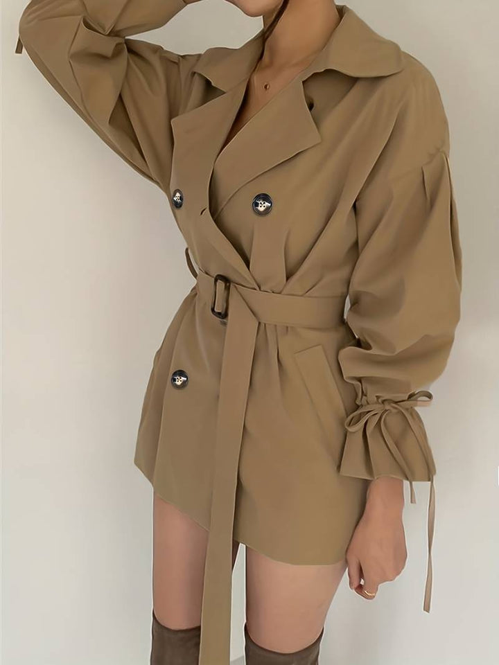 Mid-length, double-breasted trench coat with collar and belt