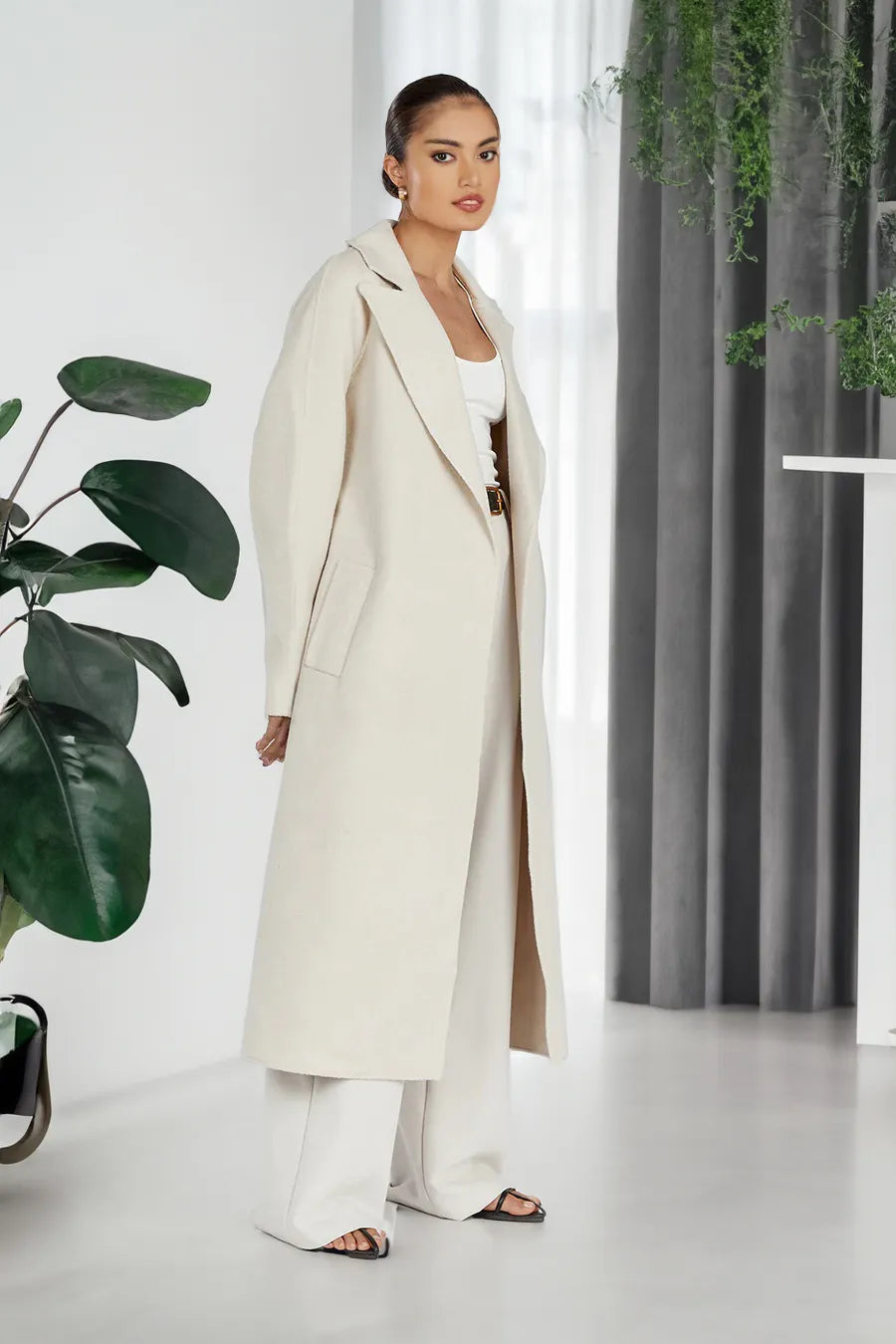 Stylish long women's trench coat in oversize style