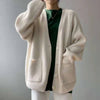 Oversized jumper with V-neck and button placket for women