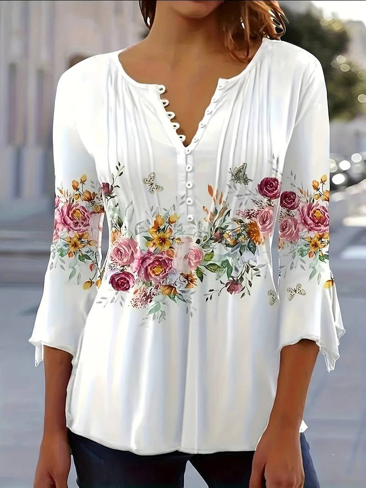 Blouse with slit neckline and floral print