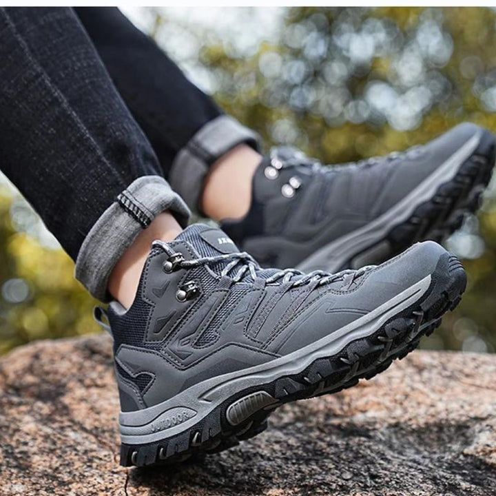 Waterproof trekking shoes with improved grip