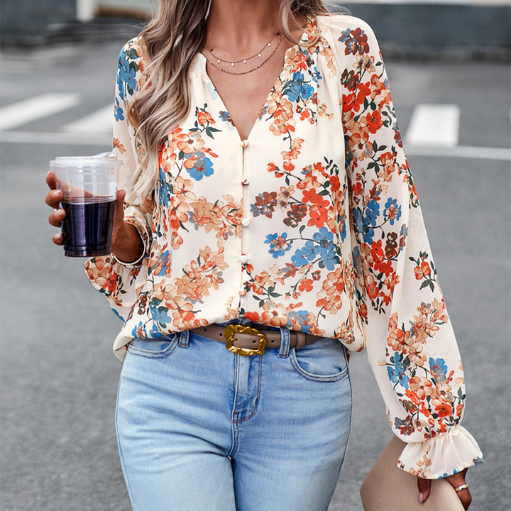 Floral blouse with V-neck and puff sleeves