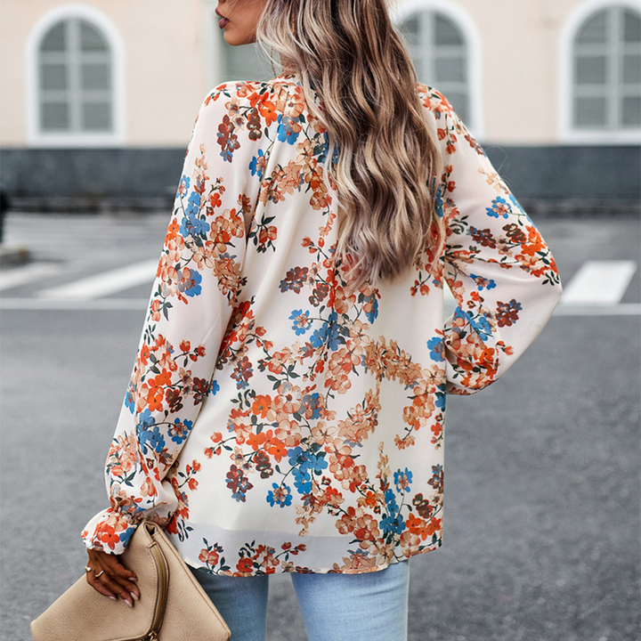 Floral blouse with V-neck and puff sleeves