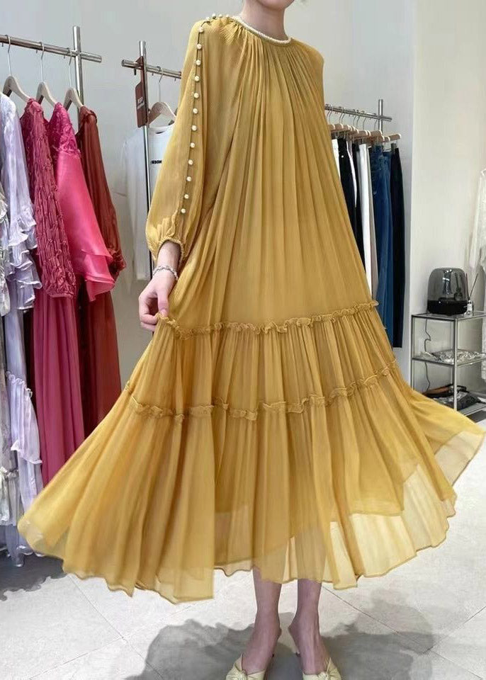 Gathered yellow silk dress with long sleeves