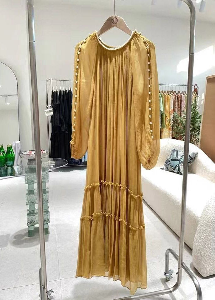 Gathered yellow silk dress with long sleeves