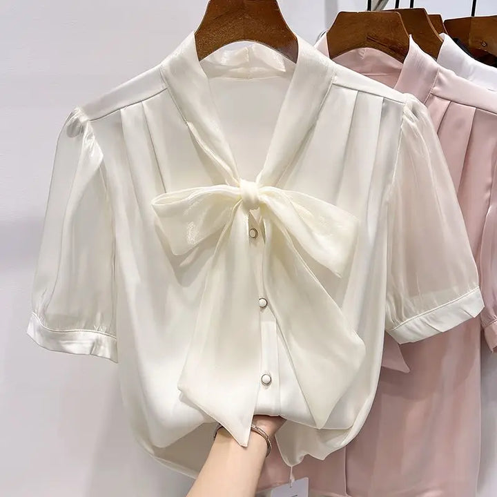 Blouse with bow and lacing