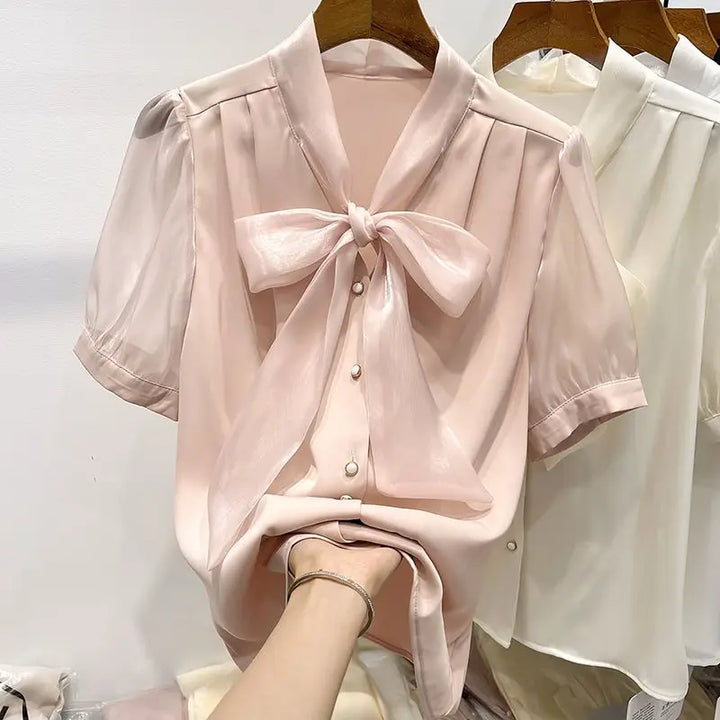 Blouse with bow and lacing