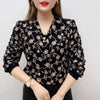 Wave pattern V-neck blouse with pearl embellishment