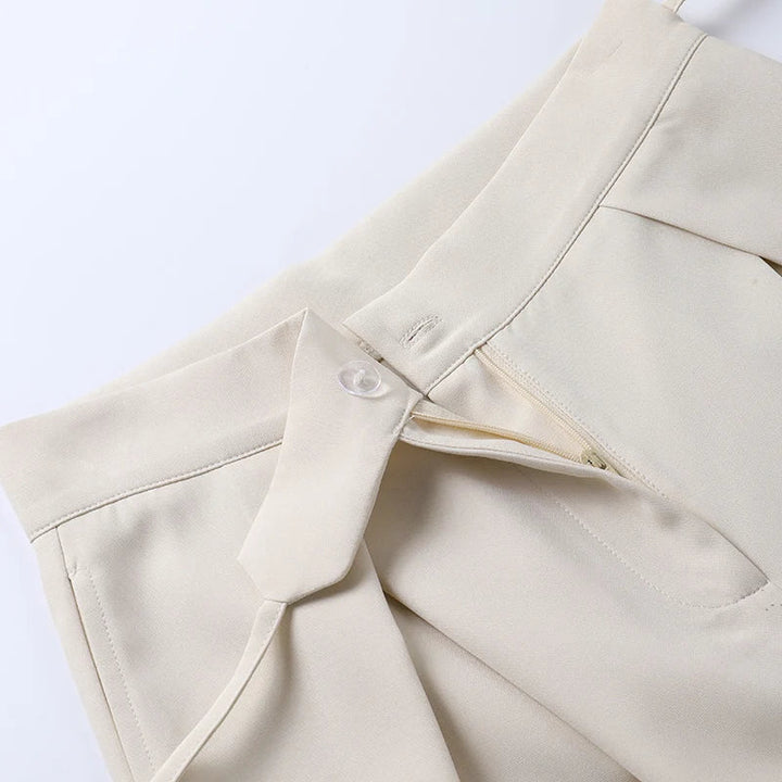 Trousers with high waist and button placket