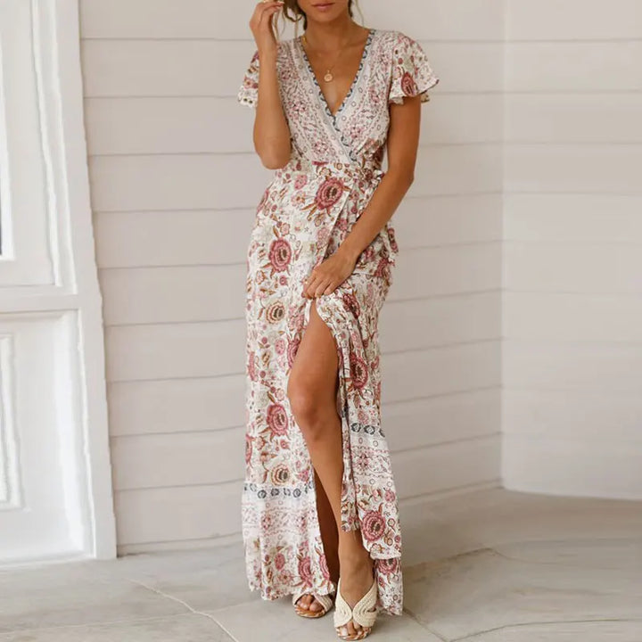 Elegant summer maxi dress with ruffles, short sleeves and a deep V-neckline