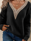 White long-sleeved jumper with V-neck and lace trim