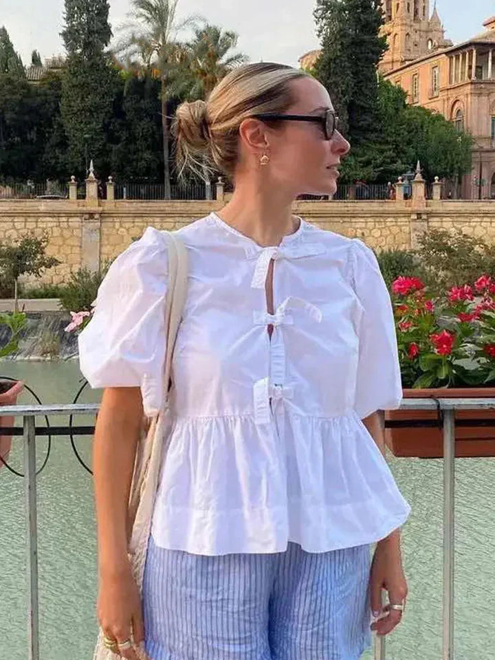 Ladies blouse with lantern sleeves and lacing