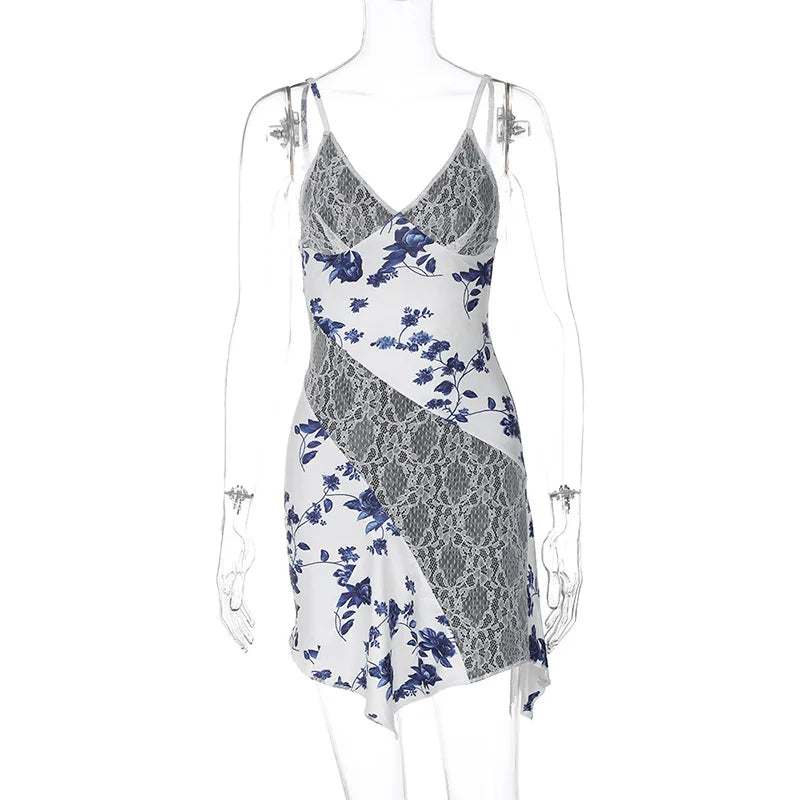 Asymmetric slip dress with lace inserts and floral accents