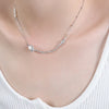 Delicate chain necklace with curved bar and single pearl embellishment