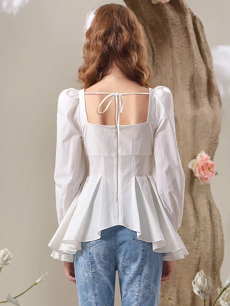 White top with rhinestone bow