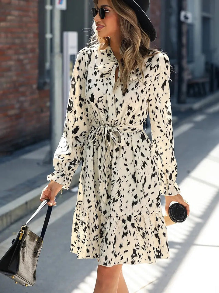 Elegant summer dress with printed lace and bell sleeves