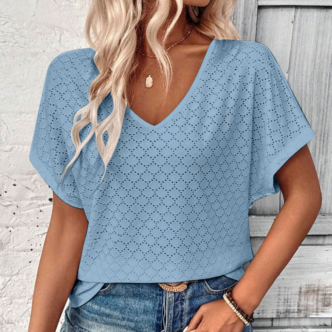 T-shirt with eyelet button embellishment and V-neckline