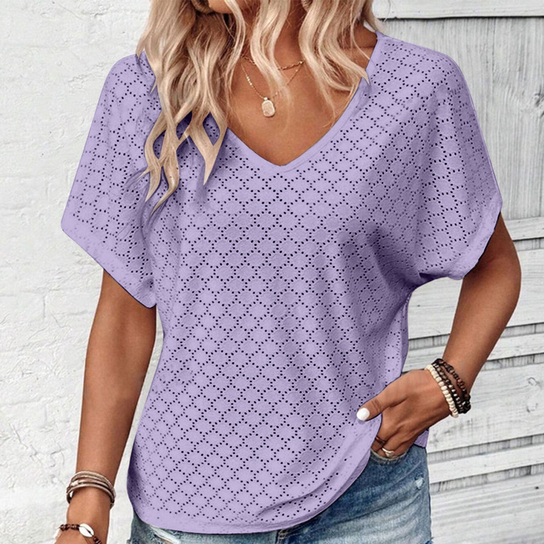 T-shirt with eyelet button embellishment and V-neckline