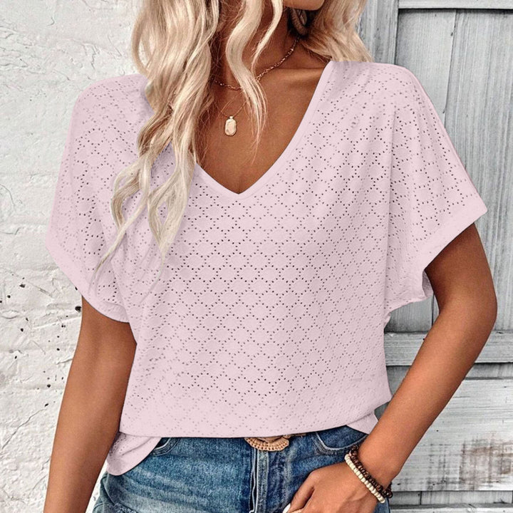 T-shirt with eyelet button embellishment and V-neckline