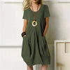 Solid-coloured dress with a loose round neckline and short sleeves