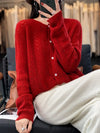 Soft knitted cardigan with cable knit pattern