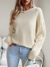 Beige jumper with knitted sleeves