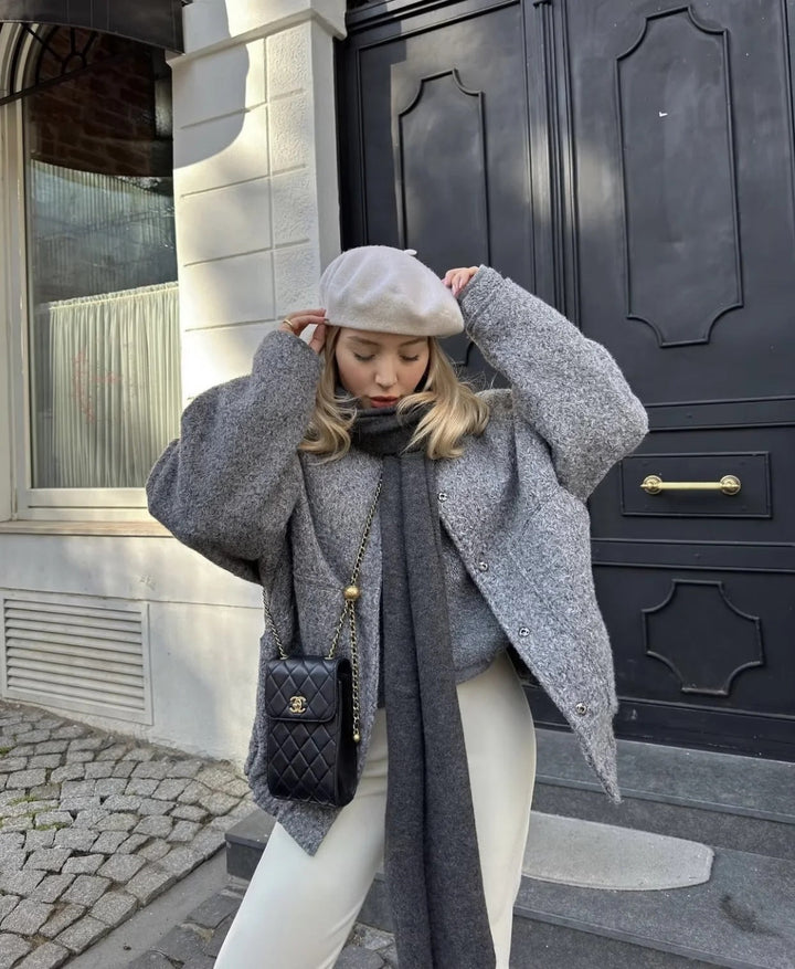 Oversized wool coat with round neckline and buttons