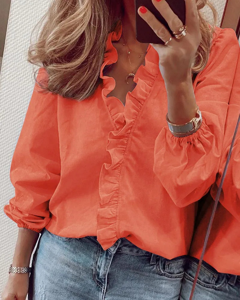 Long-sleeved blouse with ruffles