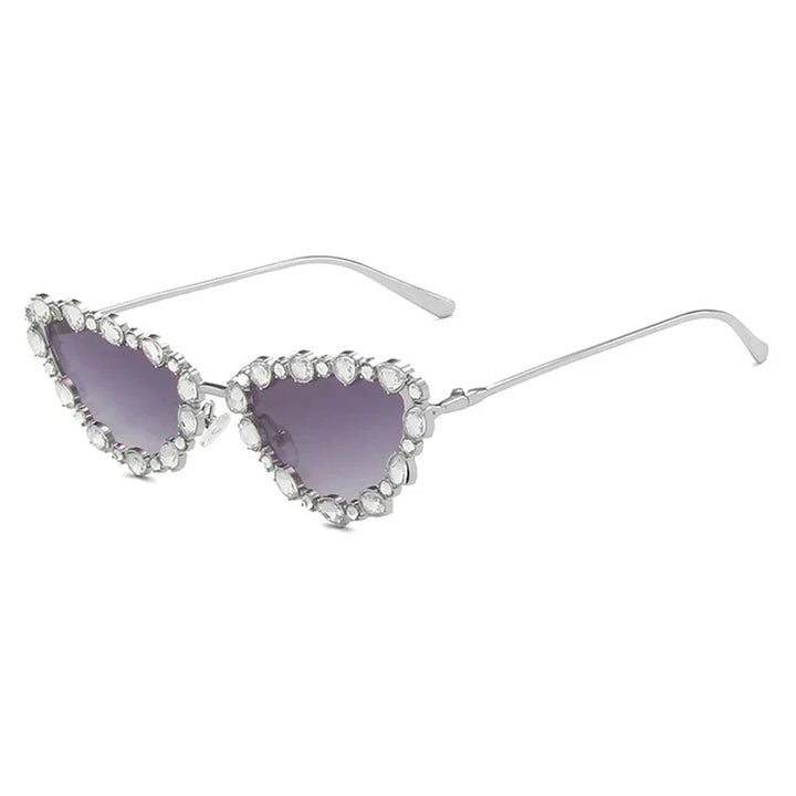 Heart-shaped sunglasses with gemstone embellishments