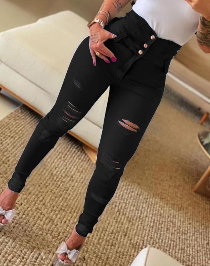 Women's jeans trend autumn fashion with high waist, buttoned cutout, ripped look