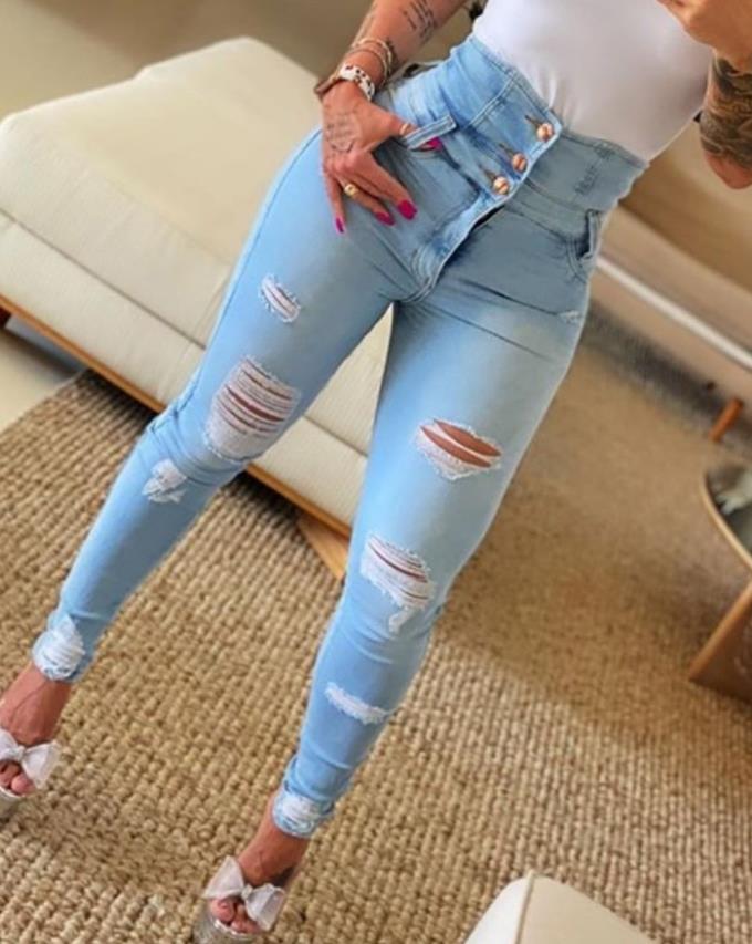 Women's jeans trend autumn fashion with high waist, buttoned cutout, ripped look