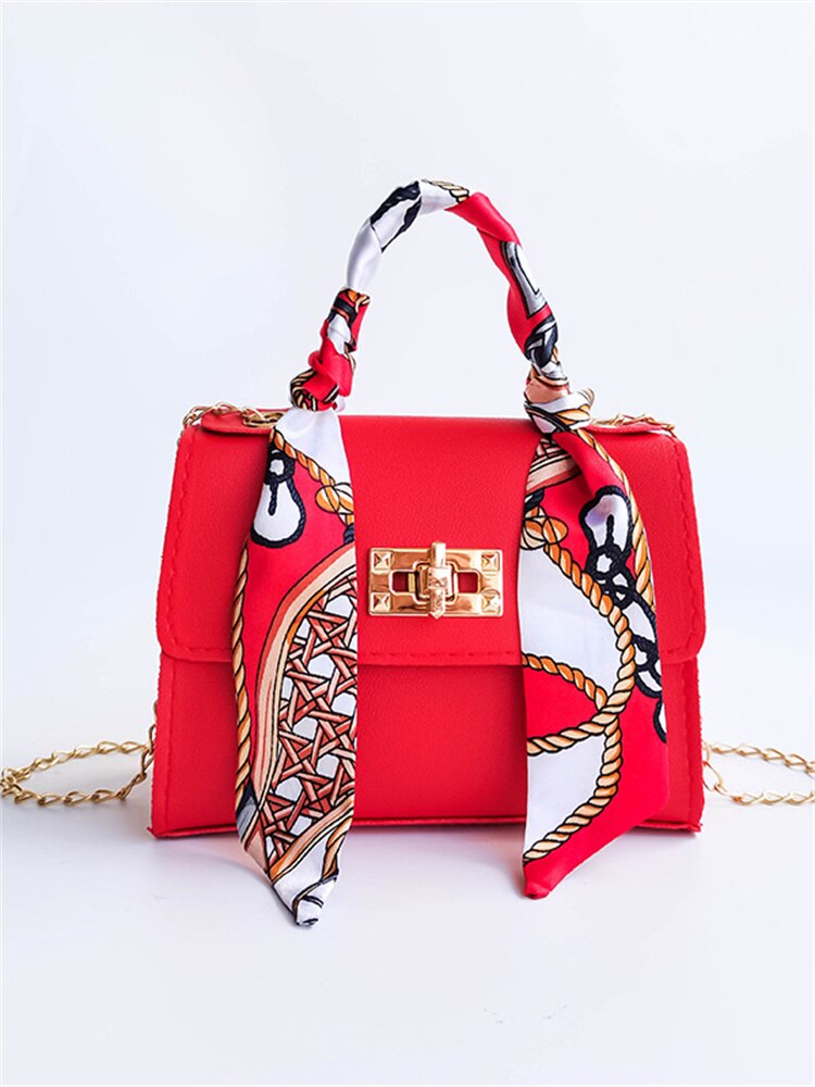 Elegant leather shoulder bag with bandana detail