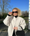 Oversized woollen coat with round neckline and buttons