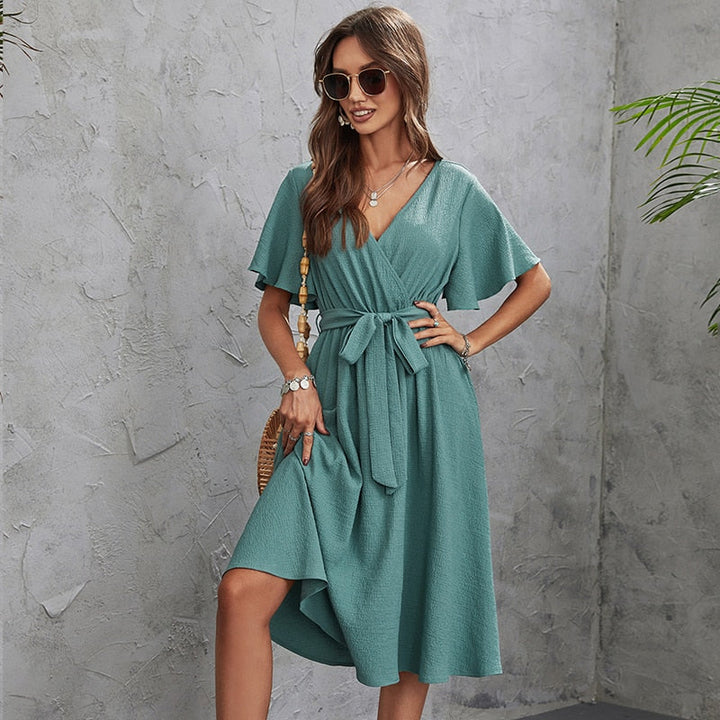 Wrap dress with V-neckline and flared sleeves